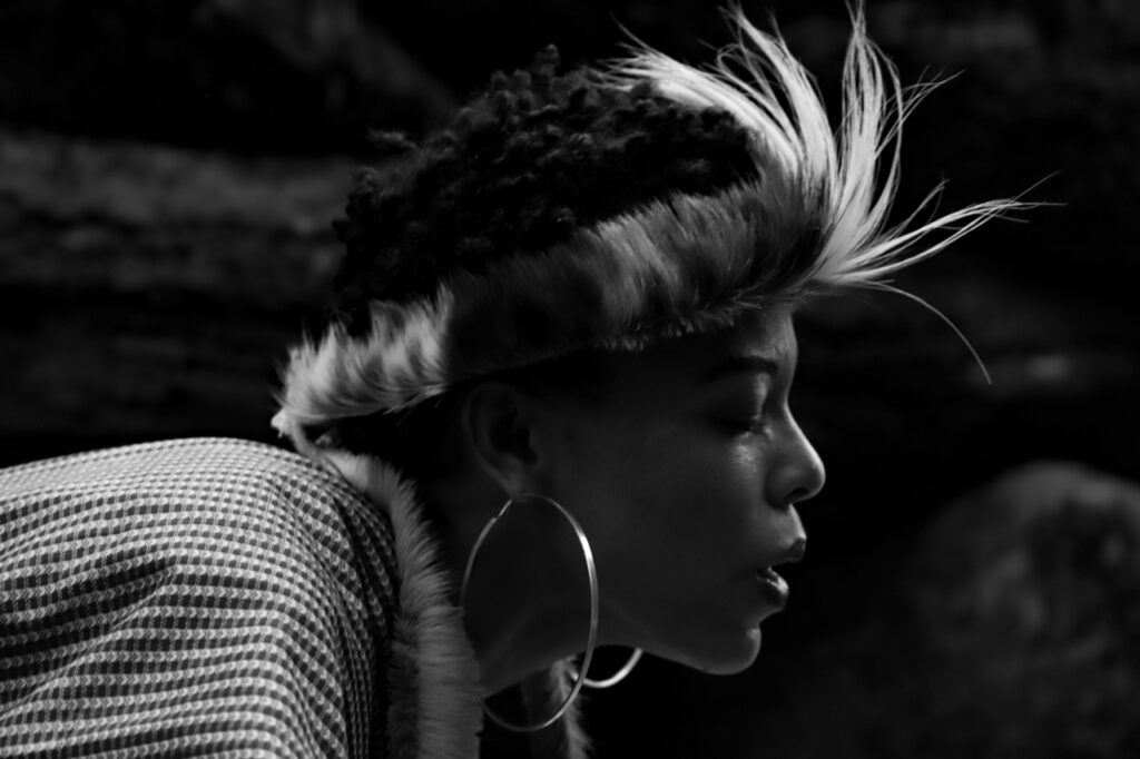 A black and white image of Gogo praying.